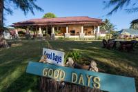 a sign that reads good days in front of a house at Gooddays Lanta Beach Resort SHA in Ko Lanta