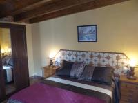 A bed or beds in a room at Casa de la Abuela Pili
