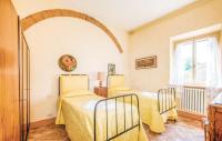 Posteľ alebo postele v izbe v ubytovaní Agriturismo Fattoria Il Piano - Appartamento Aia - San Gimignano