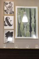 three pictures of cacti and a lamp on a wall at Best Western Hotel Lakmi Nice in Nice