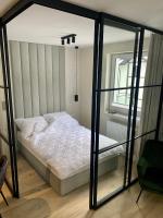 Postel nebo postele na pokoji v ubytování APARTAMENTY PIANO POLNA 28