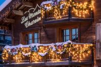 a building with christmas lights on it at Les Monts Charvin in Courchevel