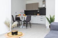 Kuchyňa alebo kuchynka v ubytovaní Bloom Apartment