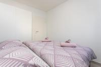 Posteľ alebo postele v izbe v ubytovaní Bloom Apartment