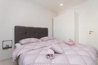 Posteľ alebo postele v izbe v ubytovaní Bloom Apartment