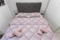 Posteľ alebo postele v izbe v ubytovaní Bloom Apartment