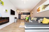 Telewizja i/lub zestaw kina domowego w obiekcie Apartaments SWEET HOME AQUA & SPA