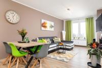 Telewizja i/lub zestaw kina domowego w obiekcie Apartaments SWEET HOME AQUA & SPA