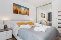 Łóżko lub łóżka w pokoju w obiekcie Apartaments SWEET HOME AQUA & SPA