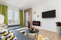 Telewizja i/lub zestaw kina domowego w obiekcie Apartaments SWEET HOME AQUA & SPA