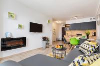 Telewizja i/lub zestaw kina domowego w obiekcie Apartaments SWEET HOME AQUA & SPA