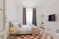 Posteľ alebo postele v izbe v ubytovaní Elegant Aparment Vittorio City Center