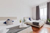 Posteľ alebo postele v izbe v ubytovaní Elegant Aparment Vittorio City Center