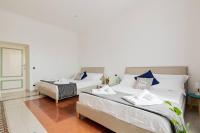 Posteľ alebo postele v izbe v ubytovaní Elegant Aparment Vittorio City Center
