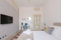 Posteľ alebo postele v izbe v ubytovaní Elegant Aparment Vittorio City Center
