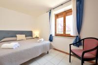 A bed or beds in a room at Villa Orrì