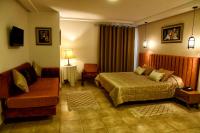 Postel nebo postele na pokoji v ubytování Larimar Hôtel Sfax