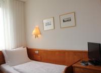 Ein Bett oder Betten in einem Zimmer der Unterkunft Hotel Kurpfalzstuben