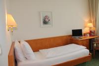 Ein Bett oder Betten in einem Zimmer der Unterkunft Hotel Kurpfalzstuben