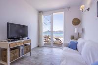 Televízia a/alebo spoločenská miestnosť v ubytovaní House Ran de Mar Beach