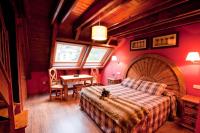Postel nebo postele na pokoji v ubytování GRAN CHALET Hotel & Petit SPA
