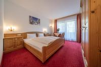 Łóżko lub łóżka w pokoju w obiekcie Hotel Similaun