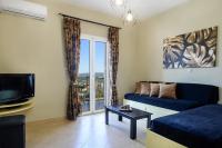 Televízia a/alebo spoločenská miestnosť v ubytovaní Nikos & Vassilis apartments Kefalonia