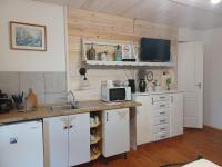 A kitchen or kitchenette at Magdolna Vendégház Magánszálláshely