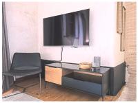 A television and/or entertainment centre at Casa Palacio Rodrigo de la Fuente by Príncipe David - Seis Apartamentos de Lujo -