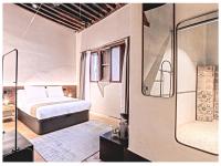 A bed or beds in a room at Casa Palacio Rodrigo de la Fuente by Príncipe David - Seis Apartamentos de Lujo -
