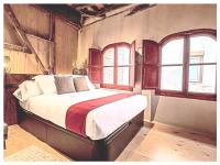 A bed or beds in a room at Casa Palacio Rodrigo de la Fuente by Príncipe David - Seis Apartamentos de Lujo -