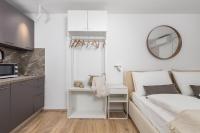 Posteľ alebo postele v izbe v ubytovaní Main Street apartments
