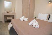 Posteľ alebo postele v izbe v ubytovaní Tereza's Sunset Hotel