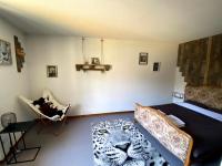 a bedroom with a bed with a leopard print rug at Auberge du Savel in Clavans-en-Haut-Oisans
