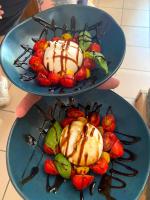 two plates of food with ice cream and fruit at Auberge du Savel in Clavans-en-Haut-Oisans