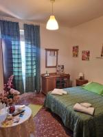 Łóżko lub łóżka w pokoju w obiekcie LA PALAZZINA