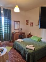Łóżko lub łóżka w pokoju w obiekcie LA PALAZZINA