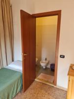 Łóżko lub łóżka w pokoju w obiekcie LA PALAZZINA