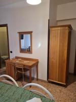 Łóżko lub łóżka w pokoju w obiekcie LA PALAZZINA