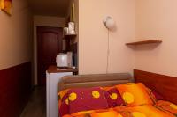 A bed or beds in a room at Erika Vendégház