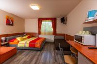 A bed or beds in a room at Erika Vendégház
