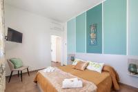 Łóżko lub łóżka w pokoju w obiekcie Prima dell'Elba Family Apartments