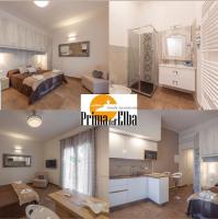 Łóżko lub łóżka w pokoju w obiekcie Prima dell'Elba Family Apartments