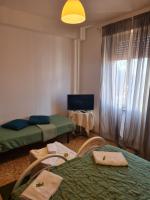 Łóżko lub łóżka w pokoju w obiekcie LA PALAZZINA