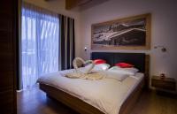 Posteľ alebo postele v izbe v ubytovaní Apartments Dolomit-Royal