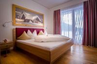 Posteľ alebo postele v izbe v ubytovaní Apartments Dolomit-Royal