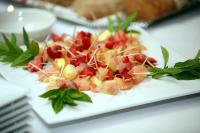 een witte plaat met groenten en fruit bij Brewery Gulch Inn & Spa in Mendocino