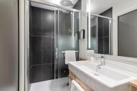 a bathroom with a sink and a shower at Campanile Epinal Centre - Gare in Épinal