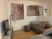 A television and/or entertainment centre at Maison del Ducato Cavour 37