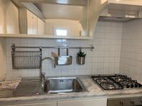 A kitchen or kitchenette at Maison del Ducato Cavour 37